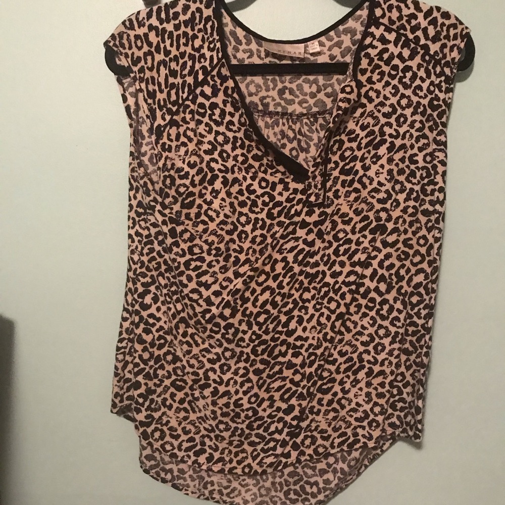 Cheetah print sleeveless shirt.